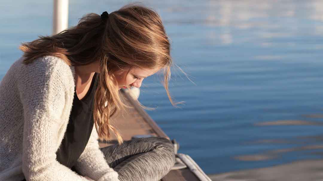 Photo of a girl reading a book.