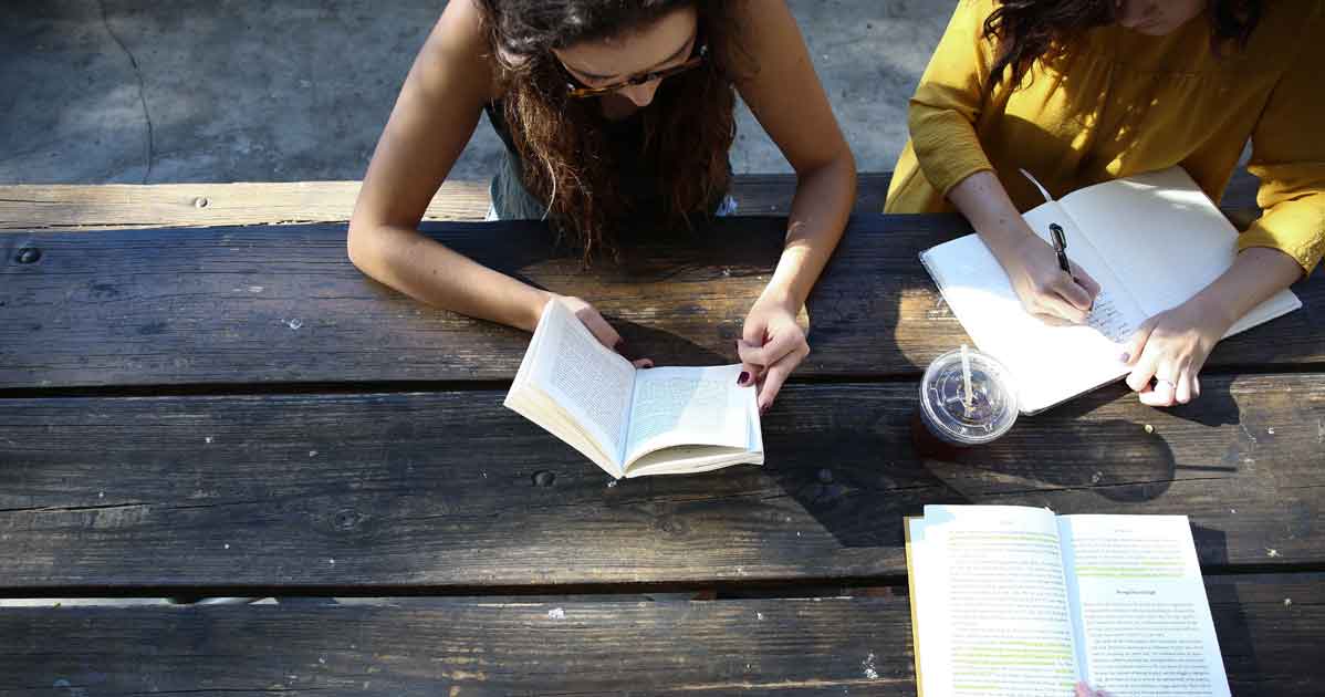Photo of 2 girls reading