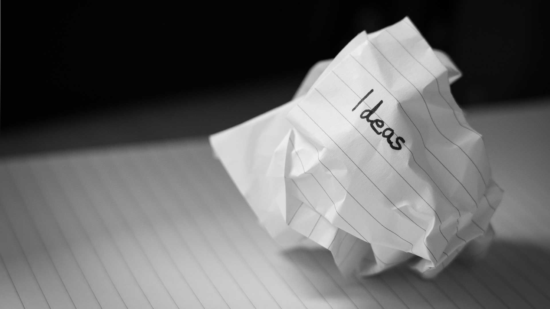 Photo of crumpled paper with the word 'ideas' on it for blog post “✍️ How to Write a Novel That Actually Works — Structure, Story, and Creative Process.” Photo by Nick Fewings on Unsplash