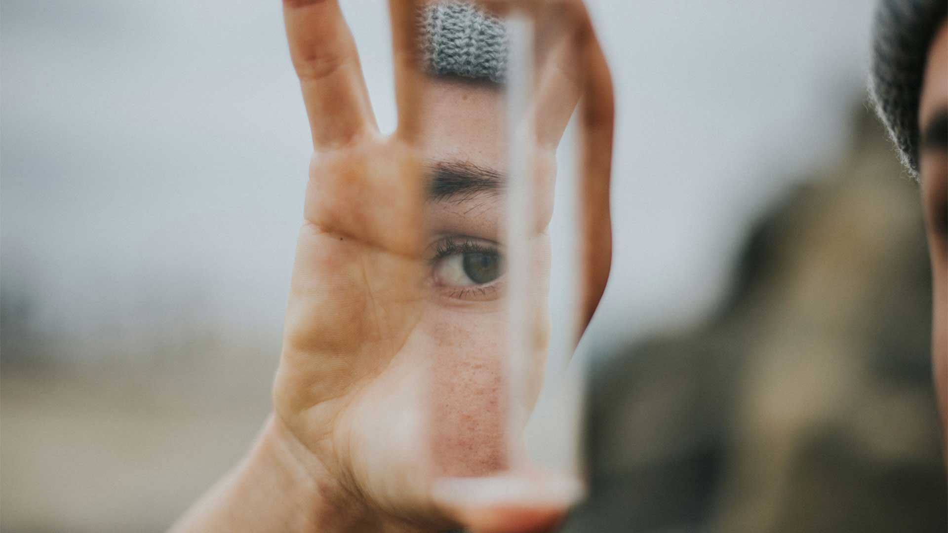 Mirror01 Photo of man holding a mirror fragment for blog post “📚 What to Read Next — A Guide to Finding Stories That Actually Stay With You.’ Photo by Vince Fleming on Unsplash