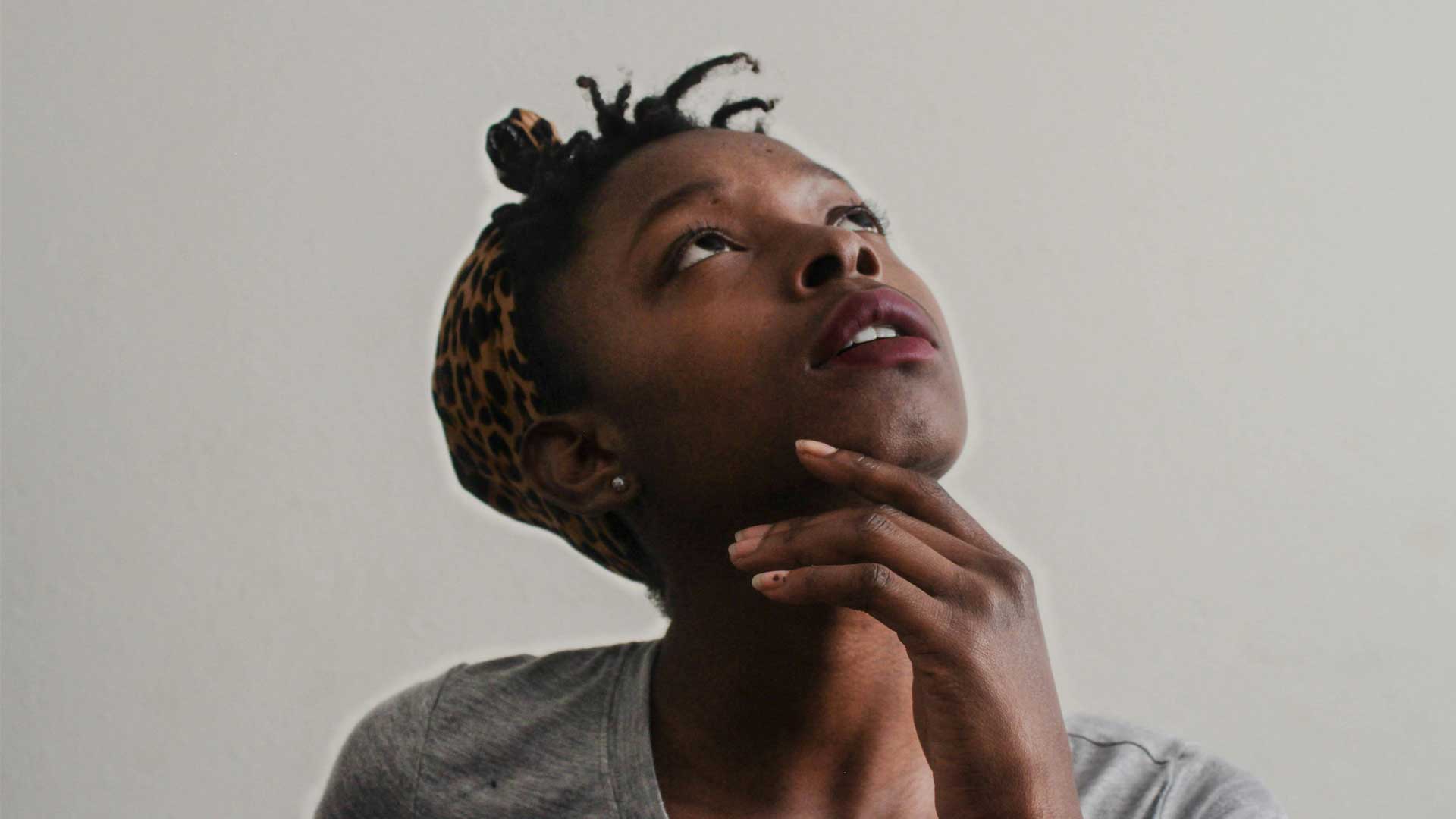 WomanLookingUpThinking01 Photo of woman looking up thinking for blog post “📚 What to Read Next — A Guide to Finding Stories That Actually Stay With You.’ Photo by Tachina Lee on Unsplash